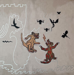 Detail of Maya animal figures and flying silhouettes of birds and drones